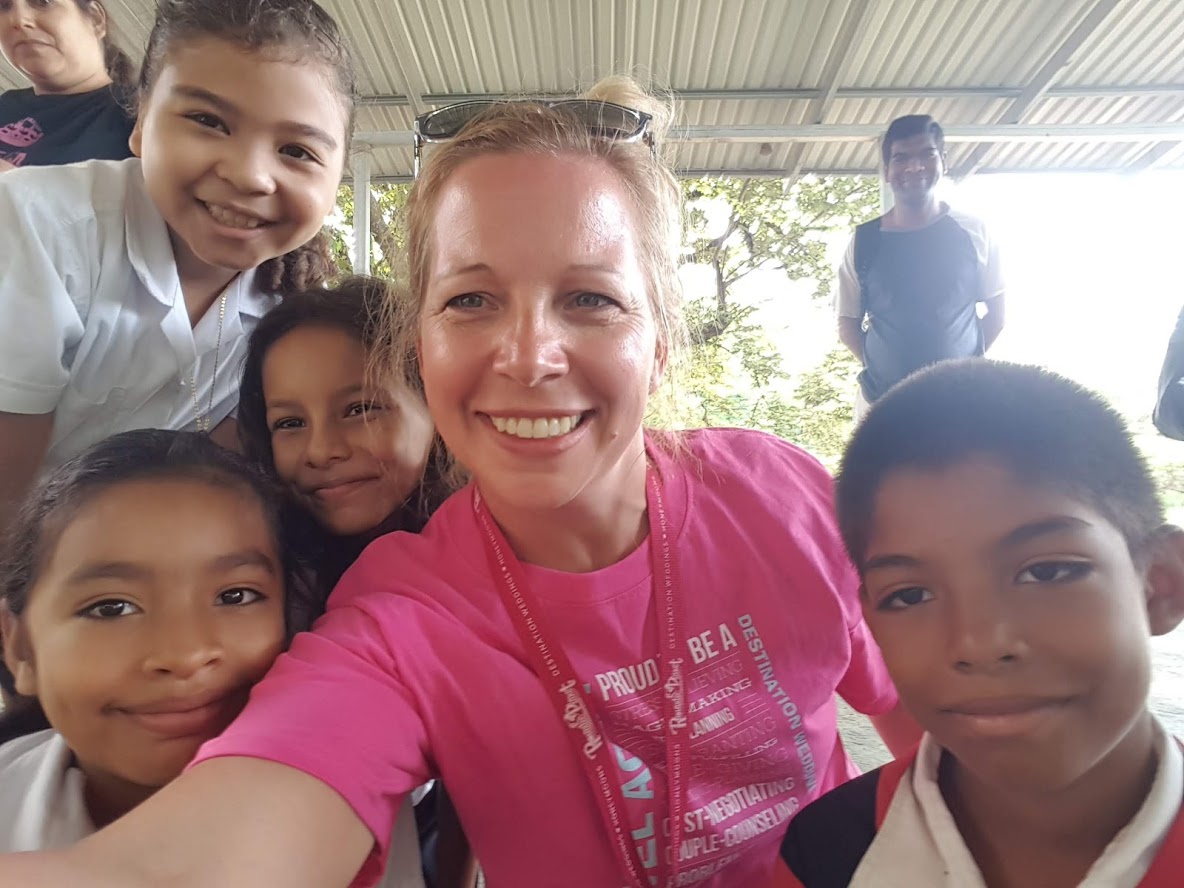 Laurie Keith, owner of Romantic Planet Vacations, volunteers at a school in Costa Rica